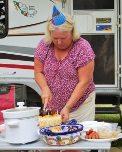 Lisa cutting Dan's Birthday Cake